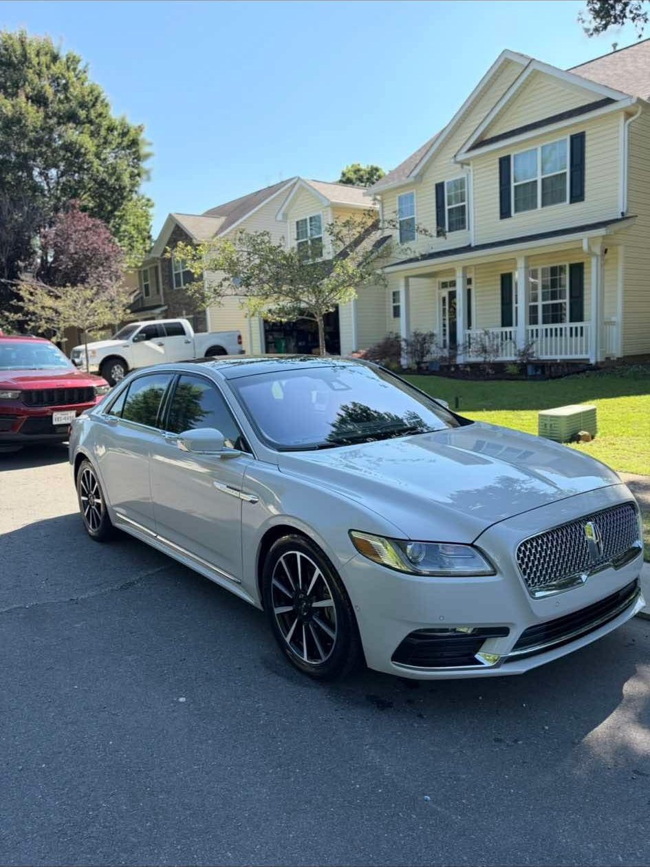 White Lincoln Continental after an interior detail