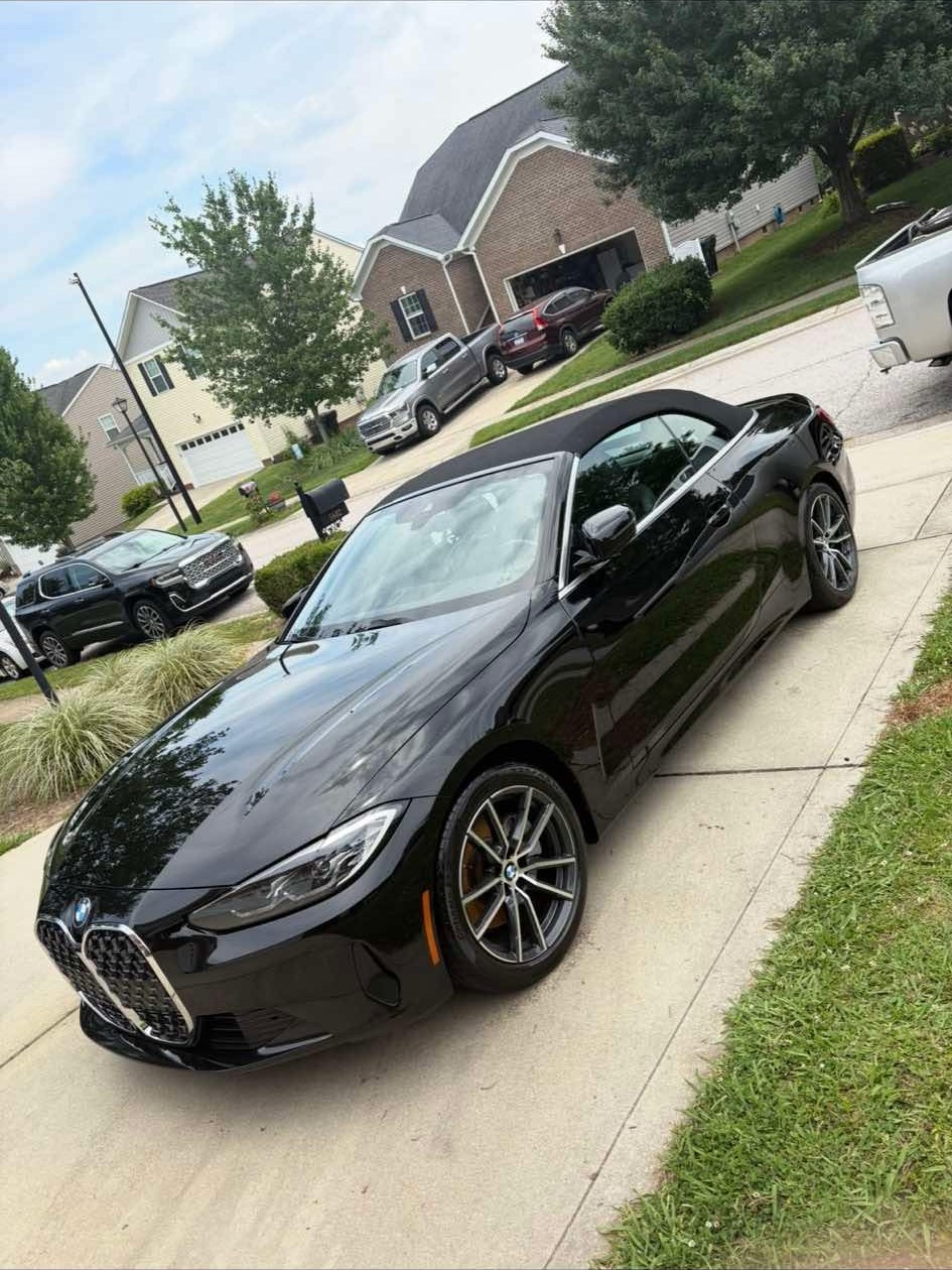 Black BMW convertible with a glossy exterior finish